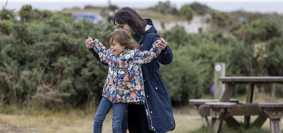 Mother and daughter enjoying the adventure playground at Dunwich Heath