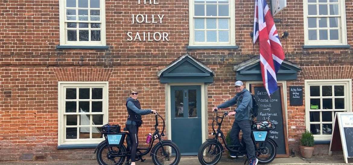 Experiences - Eezybike - two people on bikes in front of The Jolly Sailor pub