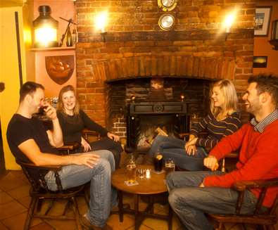 FD - The Ship at Dunwich - People in front of fire