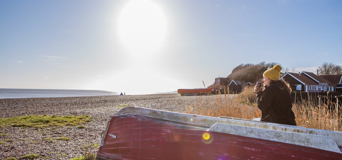 Dog walking on Dunwich Beach