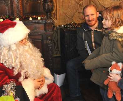 Father Christmas meeting children at Christchurch mansion
