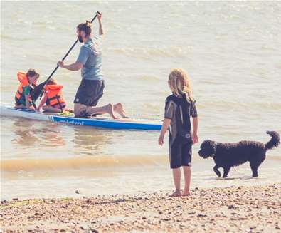 TTDA - Felixstowe Beach - Man and son paddle boarding