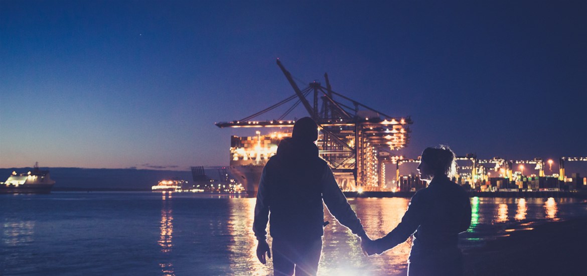 Couple walking at Felixstowe at night (c) Emily Fae Photography