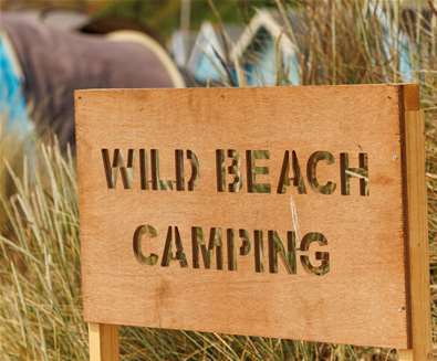 First Light Festival - Wild beach camping sign