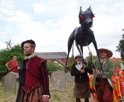 Black Shuck Festival - men carrying black shuck model