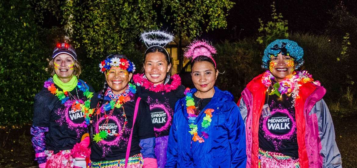 TTDA - St Elizabeth Hospice - Group of people wearing garlands and pink clothes