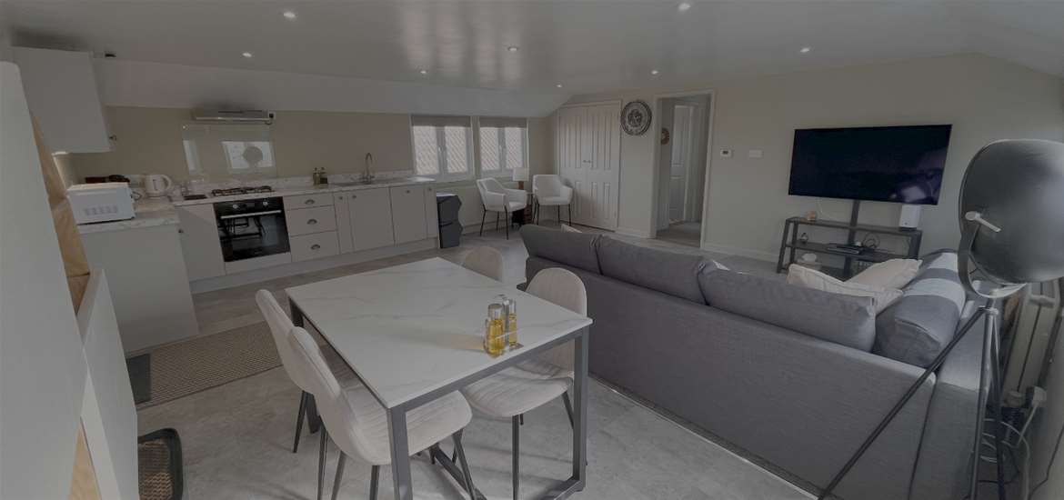 Main_Grainstore Living area from dining room.png