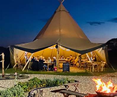 Fire and Feast - Tipi at night