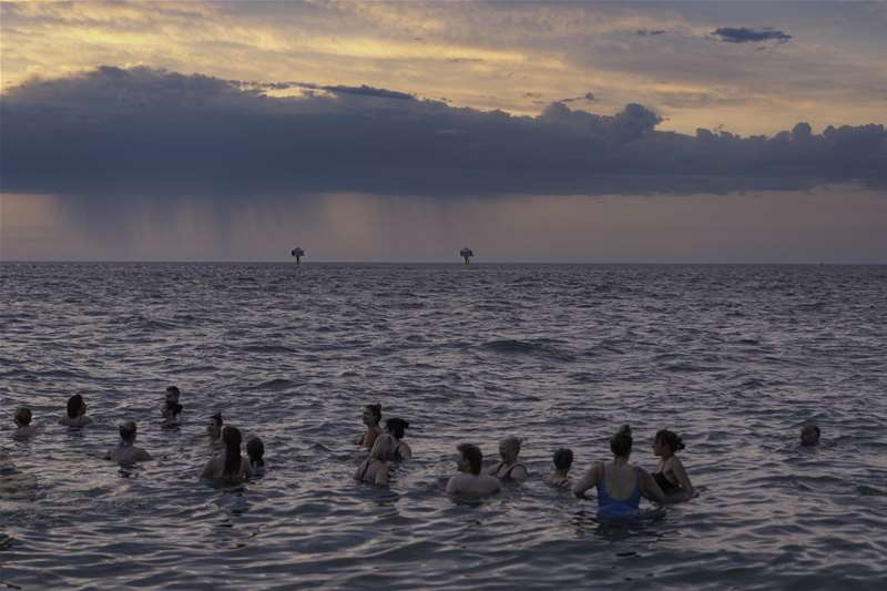 Sunrise swimming at Lowestoft (c) Adam Barnes